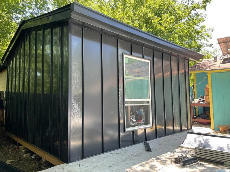 Black standing seam metal wall panels for Roof Inspection in Groton